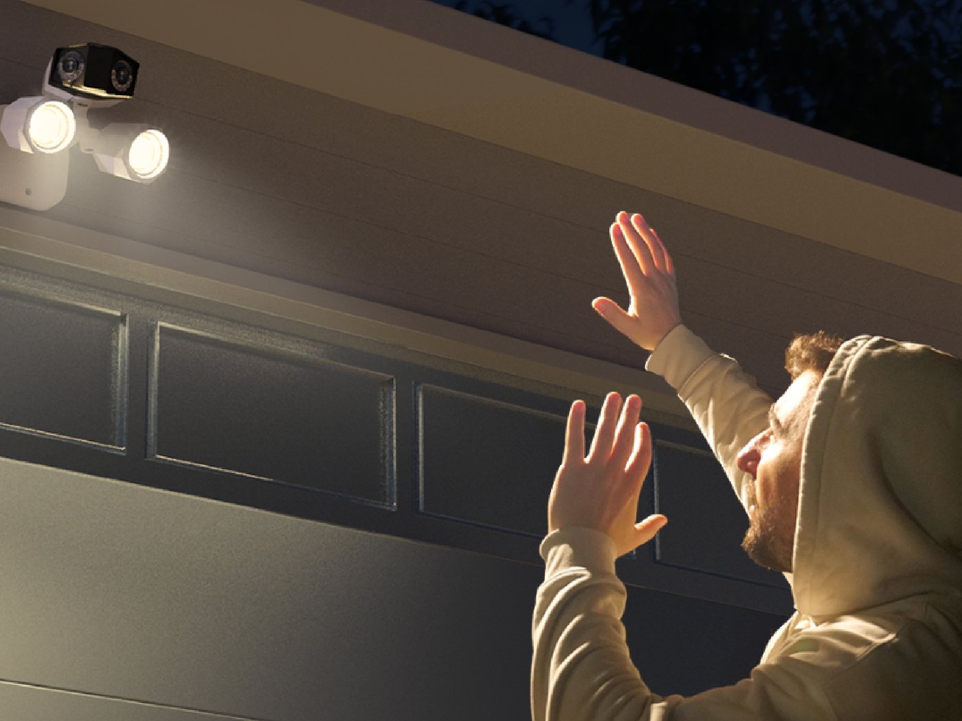 Reolink floodlight camera lit at night on a wall