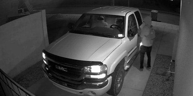 Actual infrared night footage: a truck in a driveway, black and white